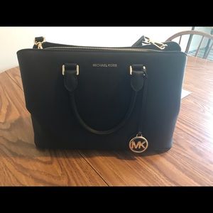 Michael Kors purse has handle wear on back handle